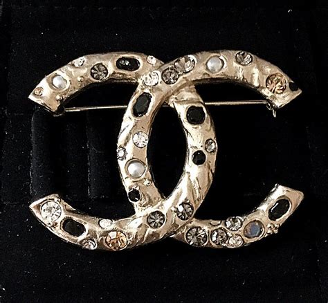 chanel paris in rome brooch|brooches clothing.